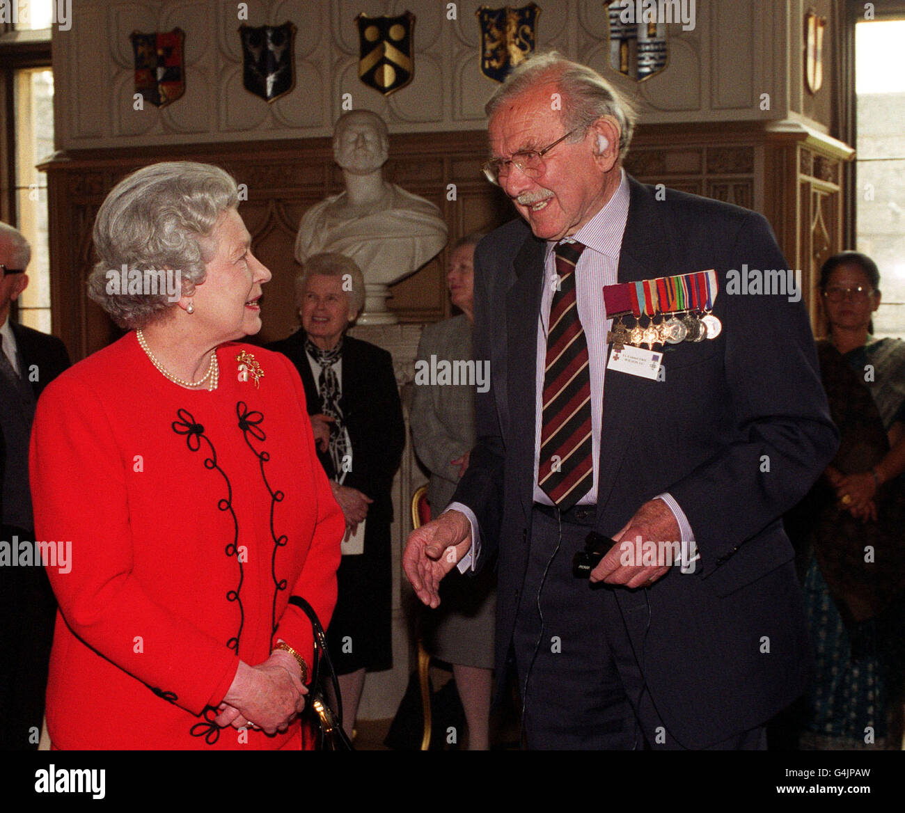 The Queen welcomed war heroes to Windsor Castle. Her Majesty met Victoria Cross veteran Captain Eric Wilson who was awarded a VC for gallantry, fighting to the last, commanding machine-gun posts in Somaliland during the Second World War. Stock Photo