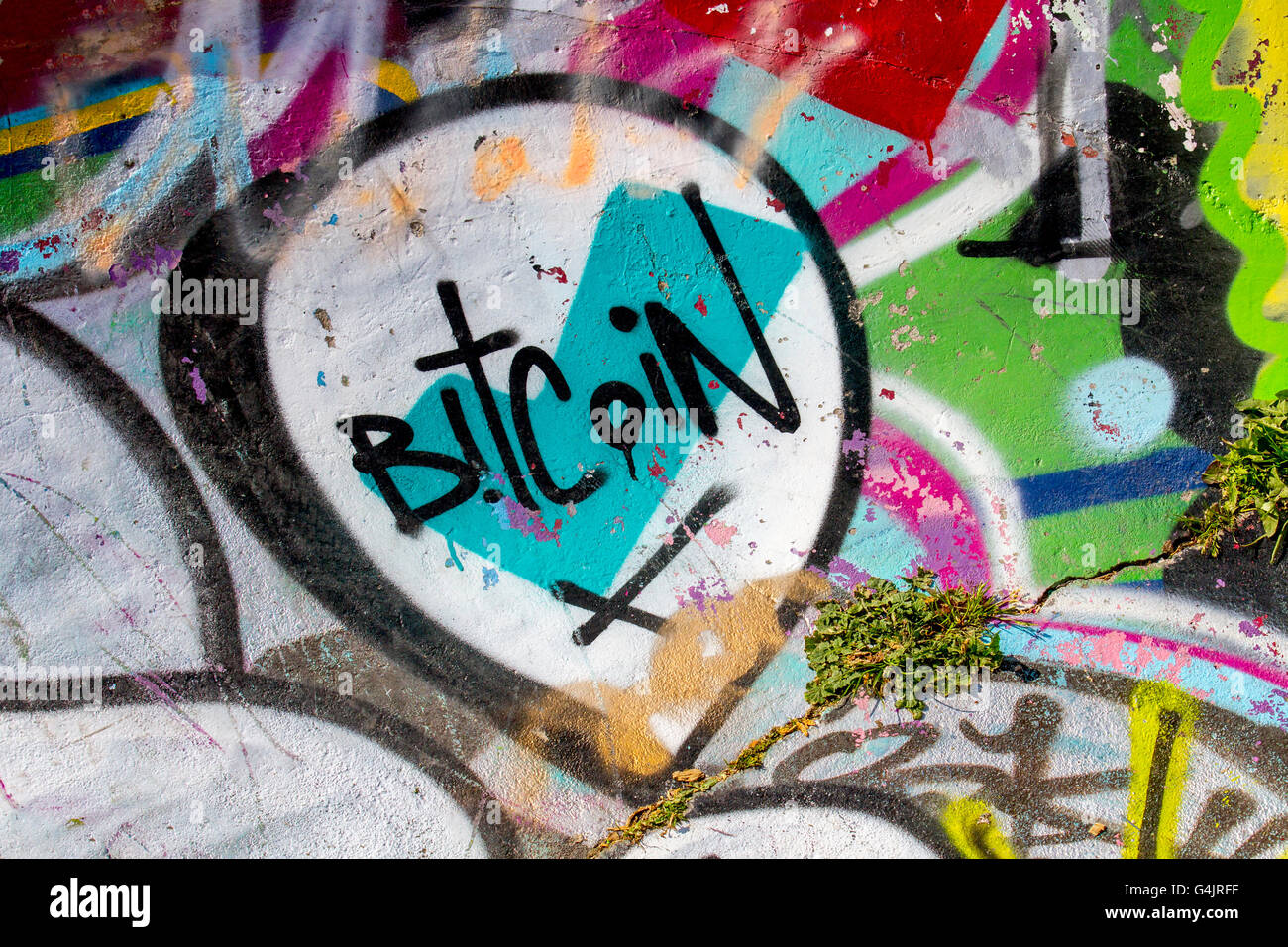 Graffiti & BitCoin, cryptocurrency, crypto currency Spray Art illustration,  grunge on the walls, ramps, and jumps of New Bird Skatepark, Liverpool,  North West England, United Kingdom. Teenage skateboarders in Liverpool have  been