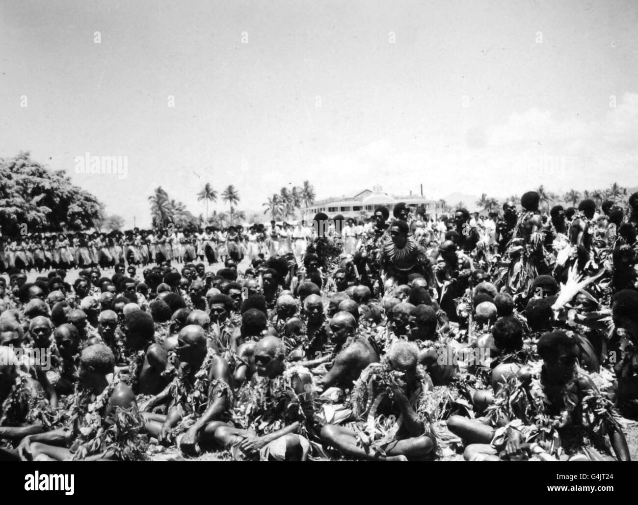 Native Fijians at a welcome meeting for Queen Elizabeth II in Albert Park, Suva, during her visit to Fiji as part of a Commonwealth tour Stock Photo