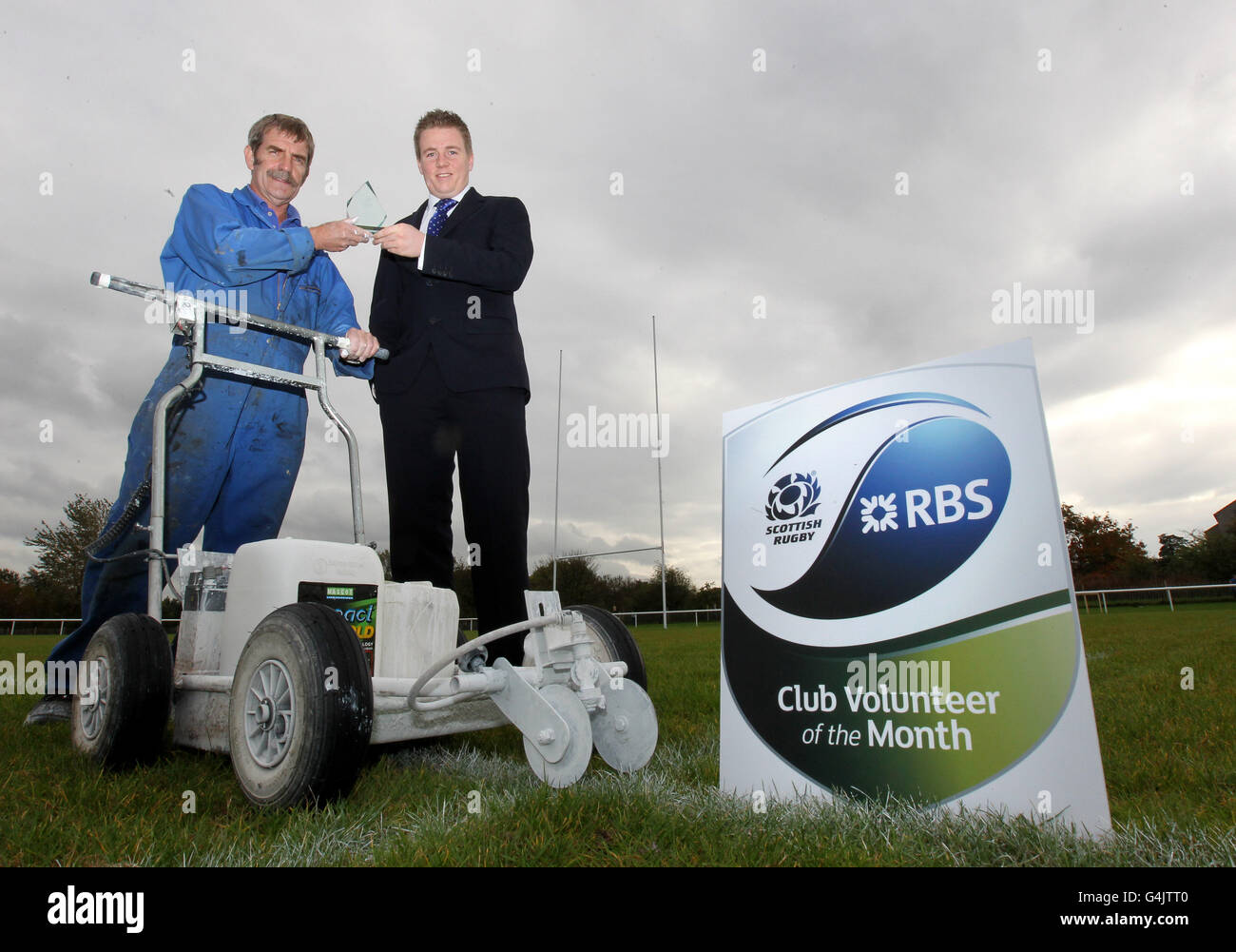 Falkirk Rugby Club groundsman Bill Arkley is presented with his RBS Club Volunteer of the Month Award by RBS Falkirk Rugby Rep Colin Stanners (right)at Falkirk RFC, Falkirk. Stock Photo