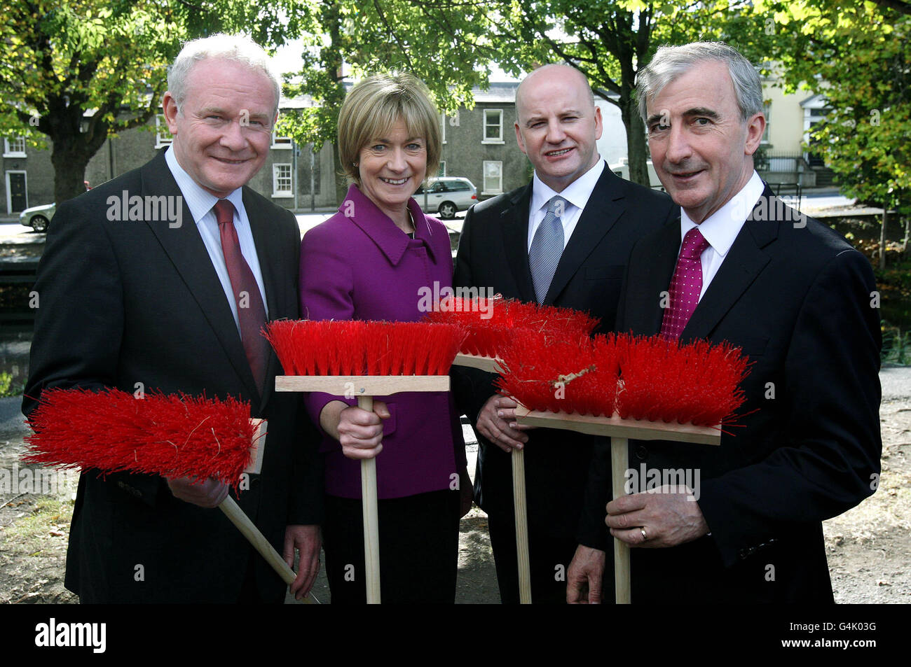 Presidential candidates (from left to right) Martin McGuinness, Mary Davis, Sean Gallagher and Gay Mitchell take part in a photo call to mark National Volunteer Day as members of Volunteer Ireland clean up Dublin's Grand Canal. Stock Photo