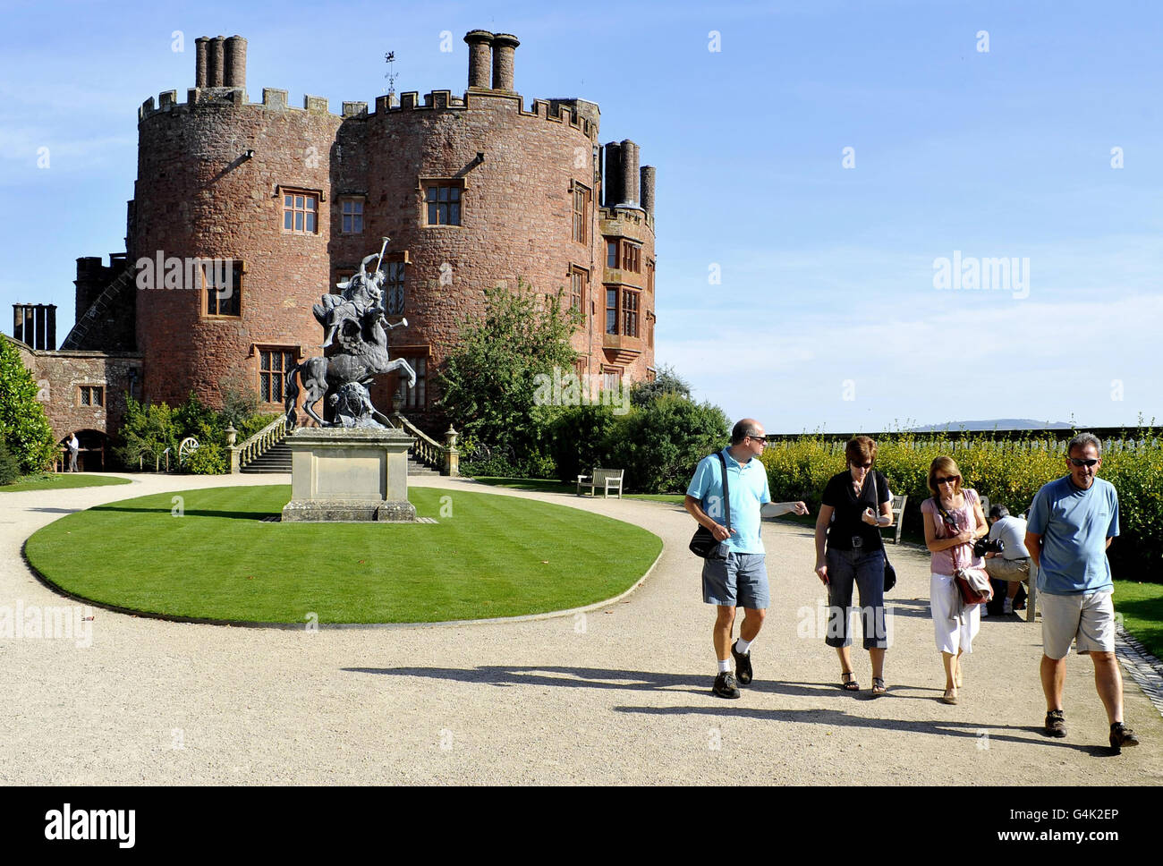 People in the grounds of the National Trust property Powis Castle and Garden in Welshpool, Powys, as the Trust celebrates reaching 4 million members. Stock Photo