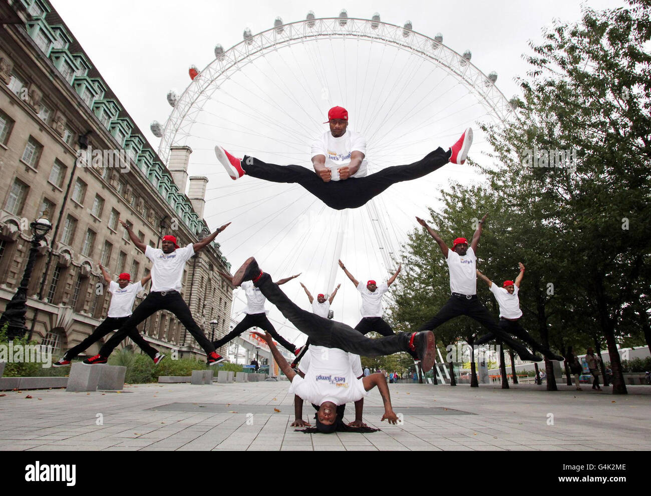 Dance troupe Flawless perform near the London Eye on the Southbank, London, during the announcement of the UK leg of National Geographic Kids Magazine's Let's Jump! International Guinness World Record campaign. Stock Photo