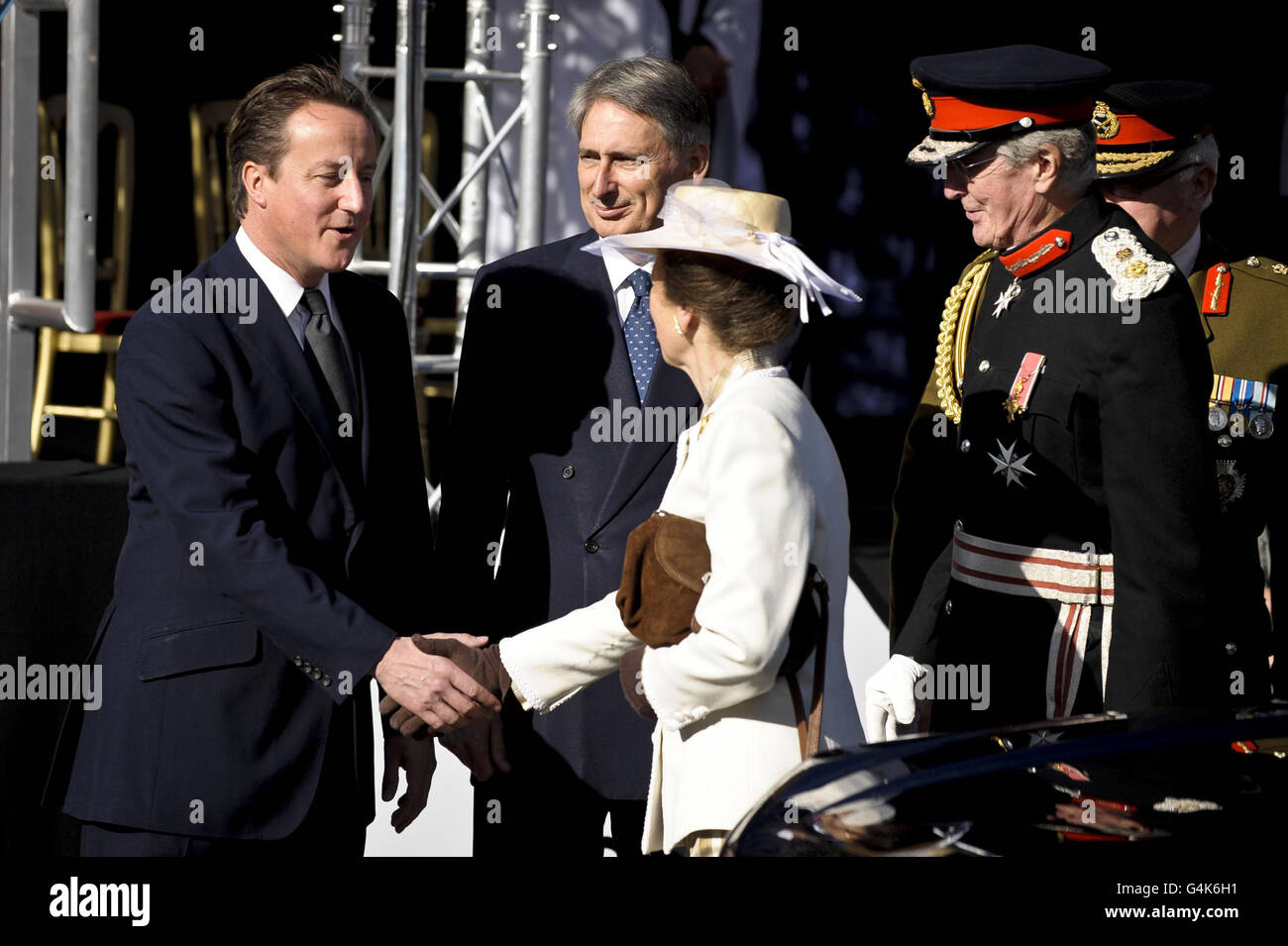 Prime minister david cameron (left)next to defence secretary philip  hammond, meets the princess royal at the commemoration event in wootton  bassett, which is receiving the royal letters patent. hi-res stock  photography and
