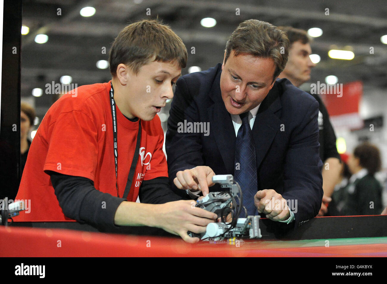 Julian Hooper, a student in Product Design at Middlesex University, explains a robotic vehicle to Prime Minister David Cameron, during a visit to the World Skills London 2011 exhibition at the ExCeL Centre. Stock Photo