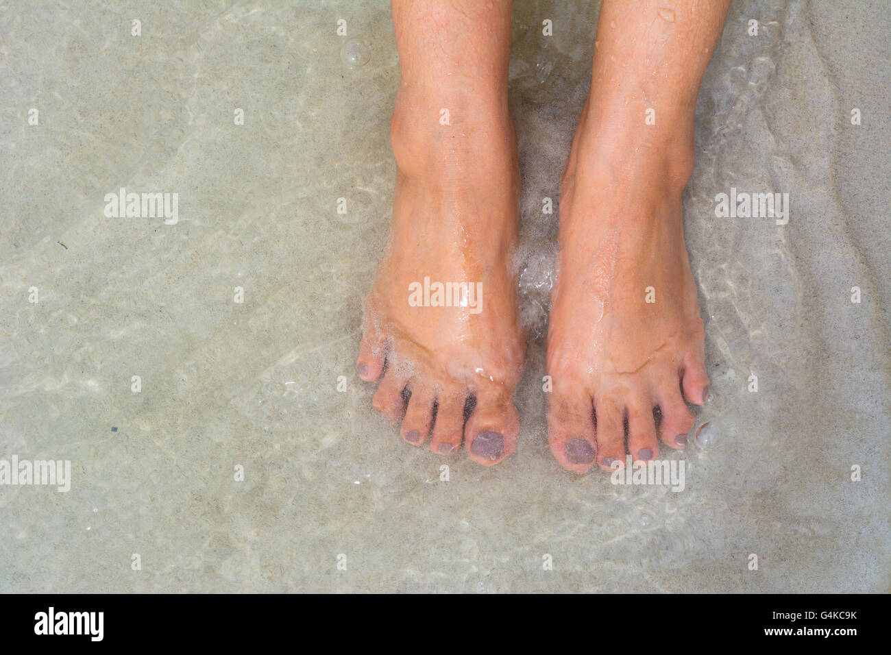 foots on the sand Stock Photo