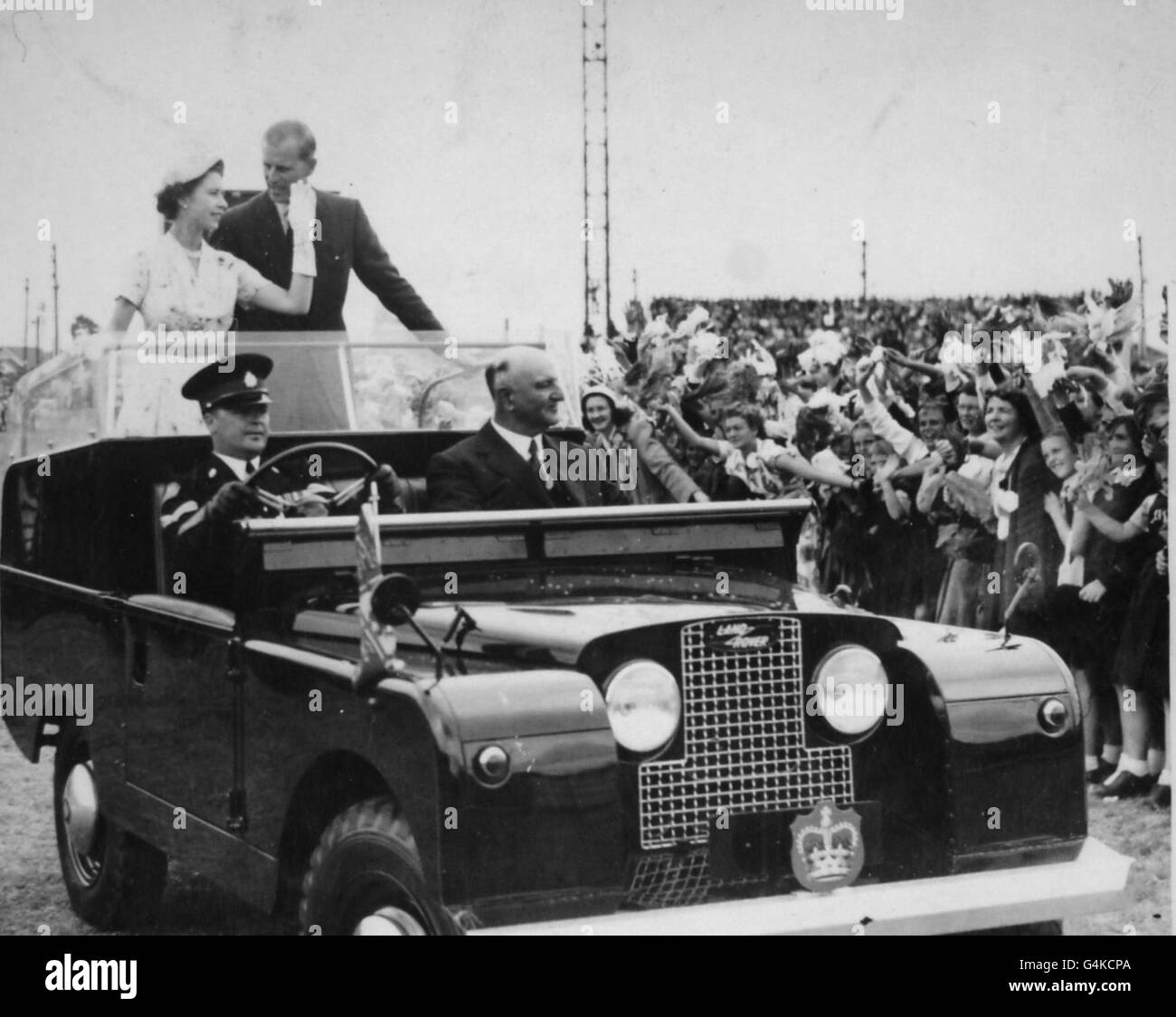 Queen Elizabeth II and the Duke of Edinburgh in an open top Land Rover in Newcastle, Australia. Stock Photo
