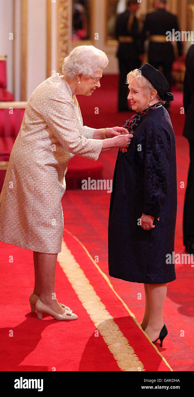 Celia Birtwell is awarded a CBE for services to the fashion industry by Queen Elizabeth II during an Investiture ceremony at Buckingham Palace, London. Stock Photo