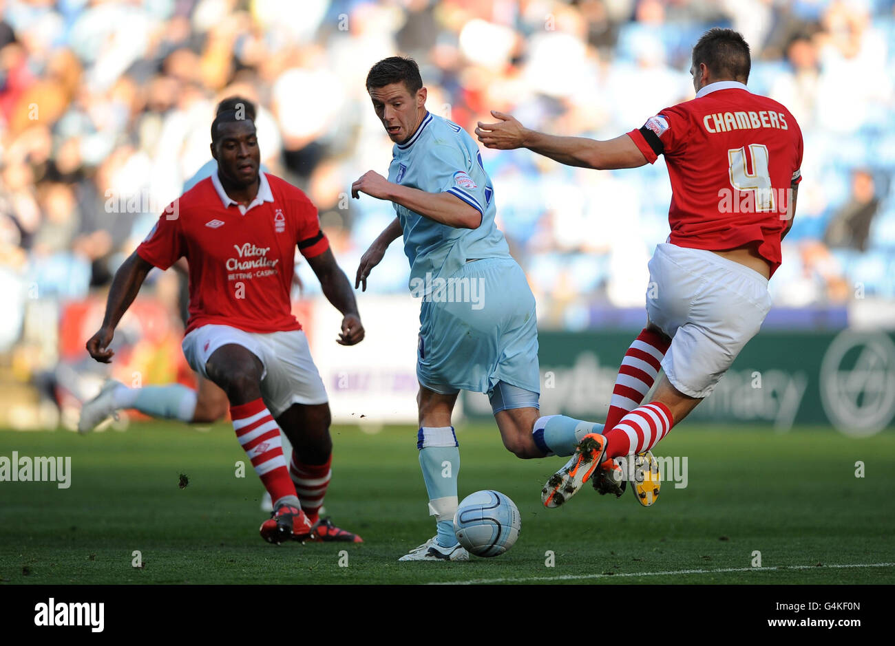 Coventry City's Lukas Jutkiewicz and Nottingham Forest's Luke Chambers (right) during the npower Football League Championship match at the Ricoh Arena, Coventry. Stock Photo
