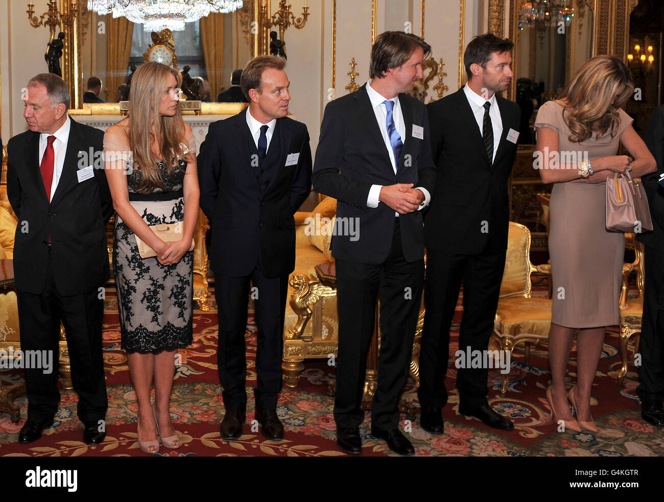 L-R: Australian High Commissioner John Dauth, Fashion designer Collette Dinnigan, Actor and singer Jason Donovan, director Tom Hooper, actor Hugh Jackman, model Elle Macpherson in the white drawing room at Buckingham Palace, before a Royal reception for members of the Australian community living in the UK. Stock Photo