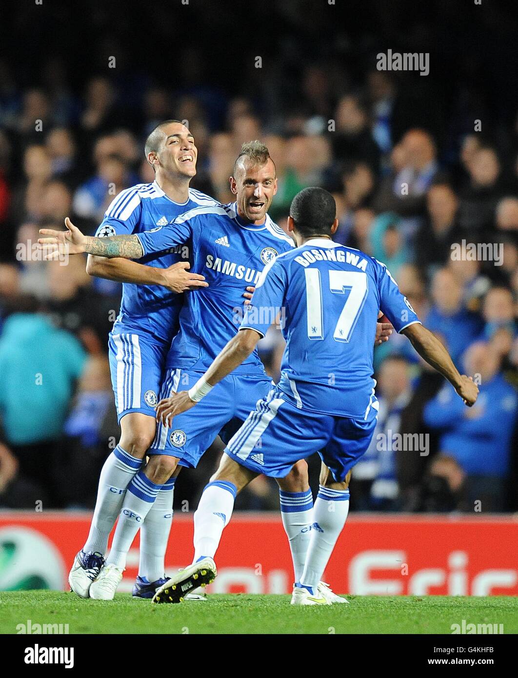 Chelsea's Raul Meireles celebrates with team mates Jose Bosingwa (right) and Oriol Romeu (left) after he scores the opening goal of the game Stock Photo