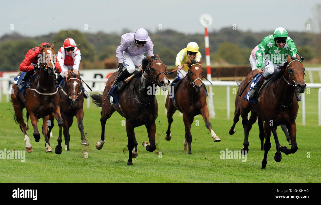 Brimstone Hill ridden by Michael Hills (right) beats Red Alpha ridden by Paul Hanagan (centre) to win the Earl of Doncaster Hotel Nursery Handicap Stakes during The Racing Post Trophy Flat Meeting at Doncaster Racecourse, Yorkshire. Stock Photo