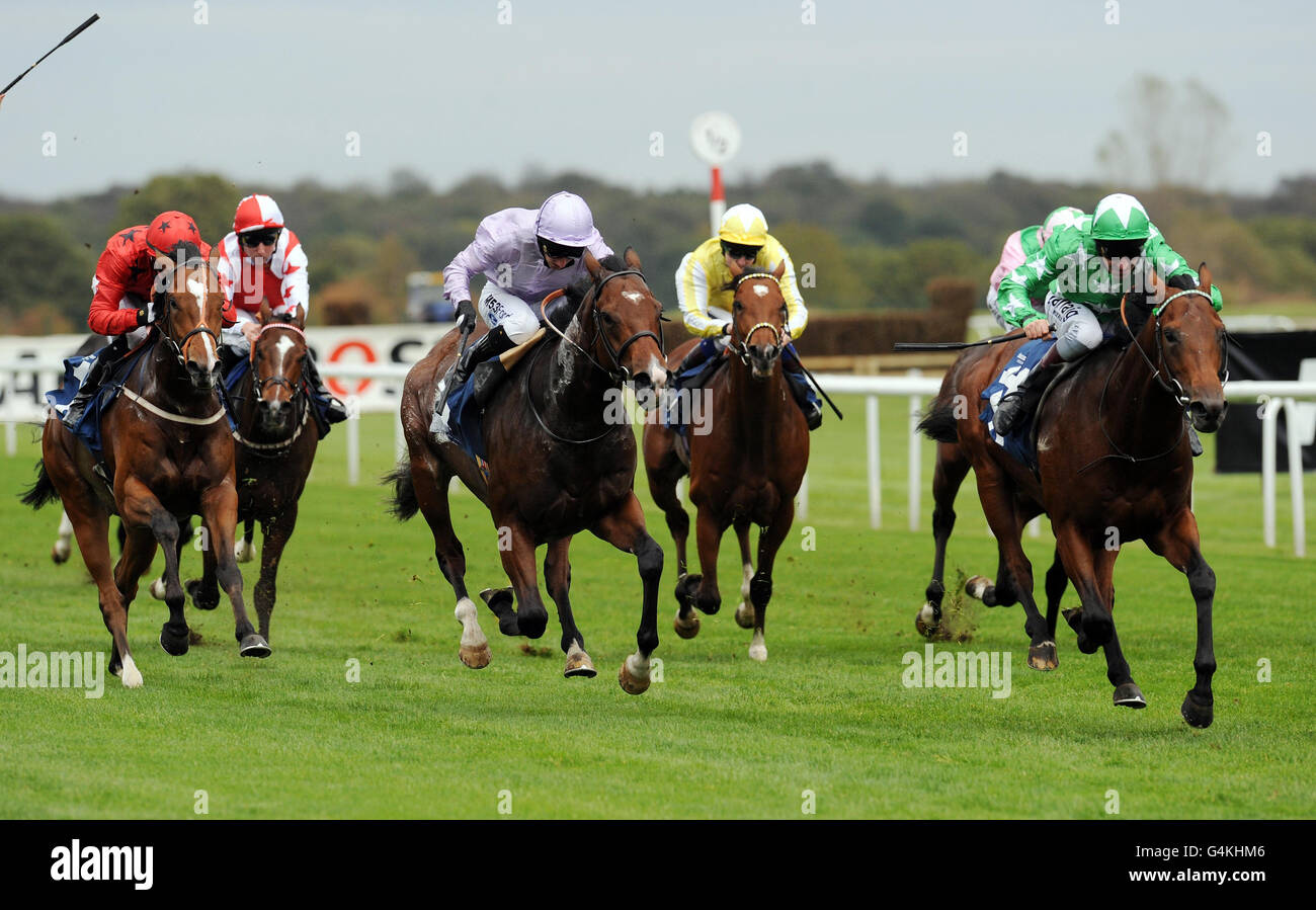 Brimstone Hill ridden by Michael Hills (right) beats Red Alpha ridden by Paul Hanagan (centre) to win the Earl of Doncaster Hotel Nursery Handicap Stakes during The Racing Post Trophy Flat Meeting at Doncaster Racecourse, Yorkshire. Stock Photo