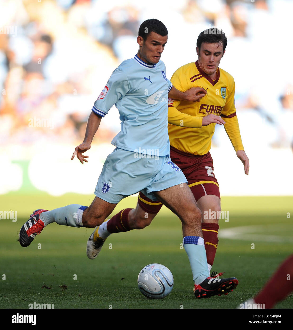Coventry City's Conor Thomas and Burnley's Keith Treacy (right) in action during the npower Football League Championship match at the Ricoh Arena, Coventry. Stock Photo