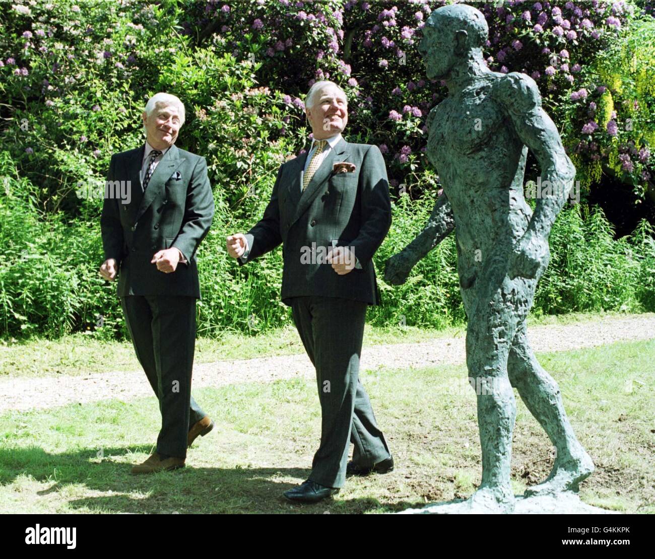 Alan Grieve (L) Chairman of the Jerwood Foundation with Sir Jocelyn Stevens, Chairman of English Heritage, admire the bronze sculpture 'Walking Man' by Dame Elizabeth Frink, one of three sculptures unveiled at Witley Court, near Worcester, Stock Photo