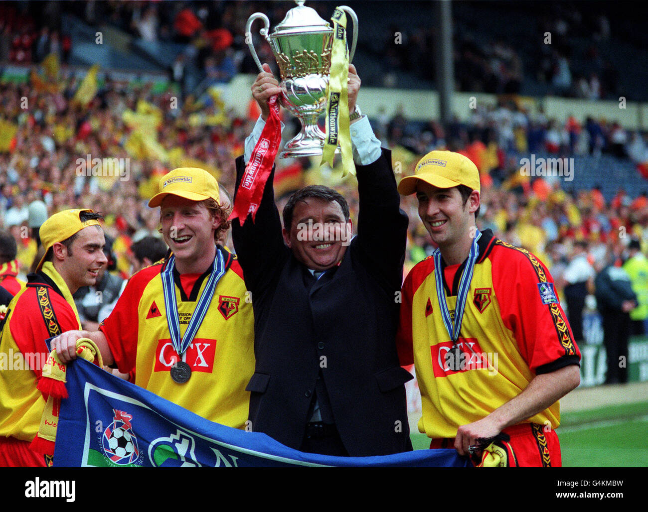 Watford manager Graham Taylor (centre) celebrates with his players after their 2-0 victory over Bolton Wanderers in the Nationwide Division One play-off final at Wembley stadium, thereby securing a place in the Premier League next season. * 29/3/01: Watford manager Graham Taylor, who has decided to retire from club management at the end of the season. The once England manager has decided to bring down the curtain on a 28 year career which began with Lincoln in 1972. 01/01/02 Football manager Graham Taylor who has been made an OBE (Officer of the British Empire) for services to Association Stock Photo