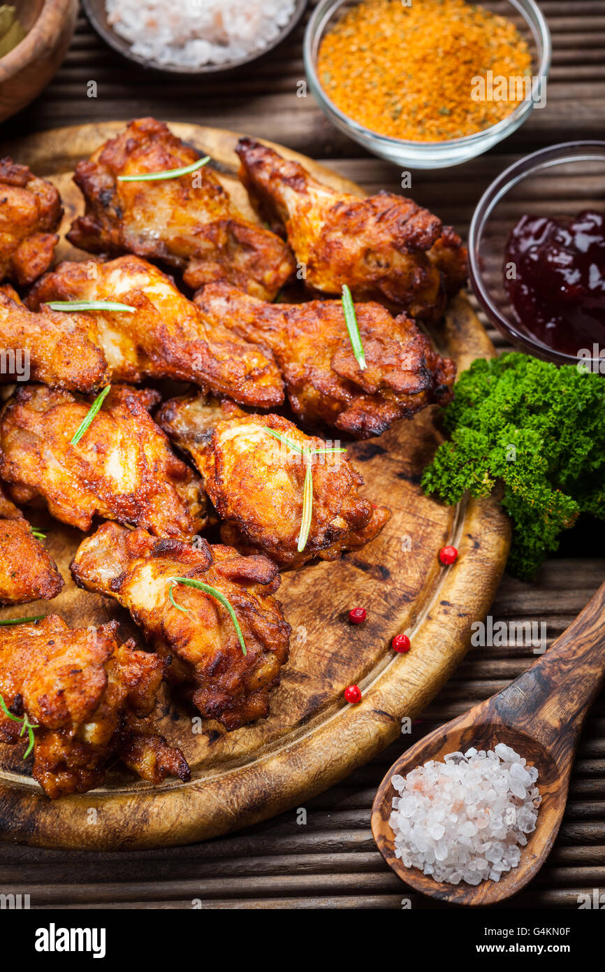 BBQ chicken wings with spices and dips Stock Photo