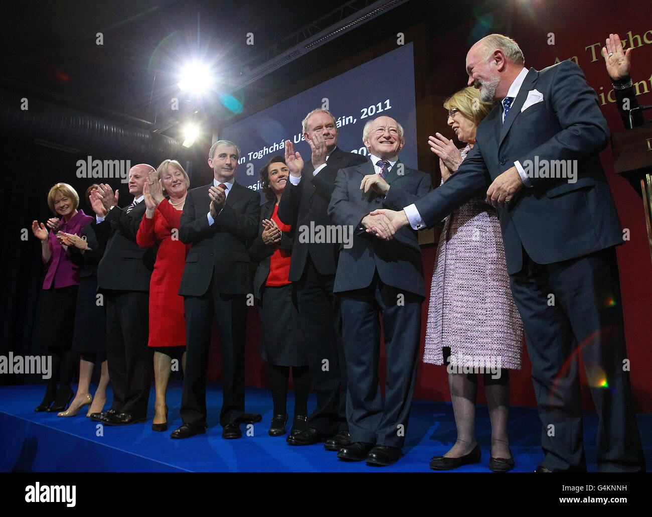 Presidential candidates Mary Davis (1st left), Sean Gallagher (3rd left), Gay Mitchell (5th left), Martin McGuinness (7th left), Michael D Higgins (8th left) shaking hands with David Norris (10th left) at the announcement of the first preference votes in the Irish Presidential Election at the count centre in Dublin castle. Higgins will be Ireland's ninth president. Stock Photo