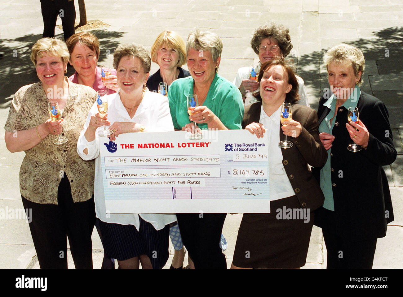 A syndincate of eight nurses from North Wales arrive in London to collect the winning cheque for 8,169,785 pounds from Camelot National Lottery. The winners are (l-r) C. Davies, C. Lovell, G. Churchill, Z. Zara Clarke, P. Williams, M. Story, A. Lewis and G. Jones. * Carol Davies, Carys Lovell (51) Glenys Churchill ( 61) Zara Clarke ( 51)Pearl Williams (56) Menna Story ( 51) Amanda Lewis (33) and Glenys Jones (49). Stock Photo