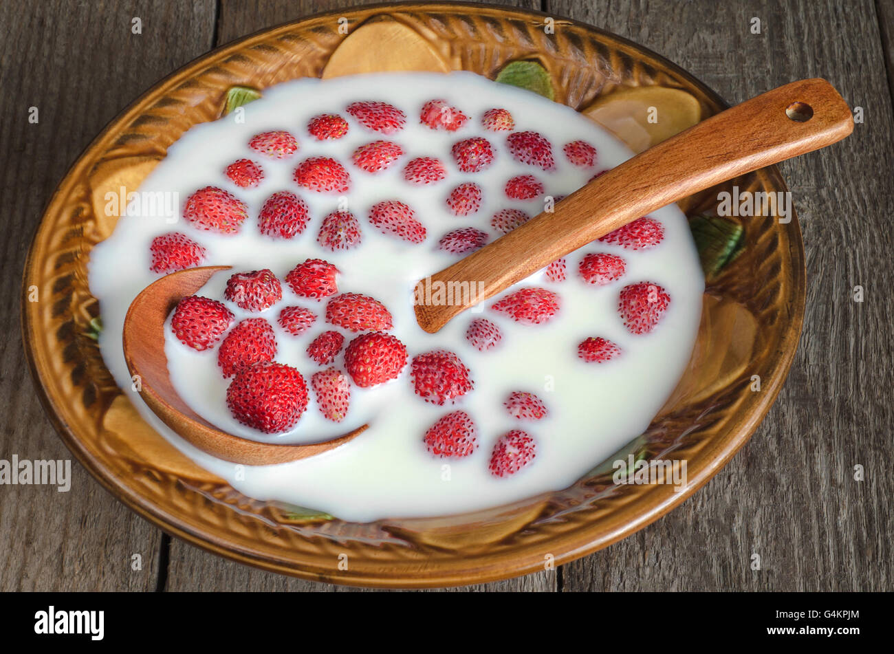 Strawberries with milk in a bowl Stock Photo