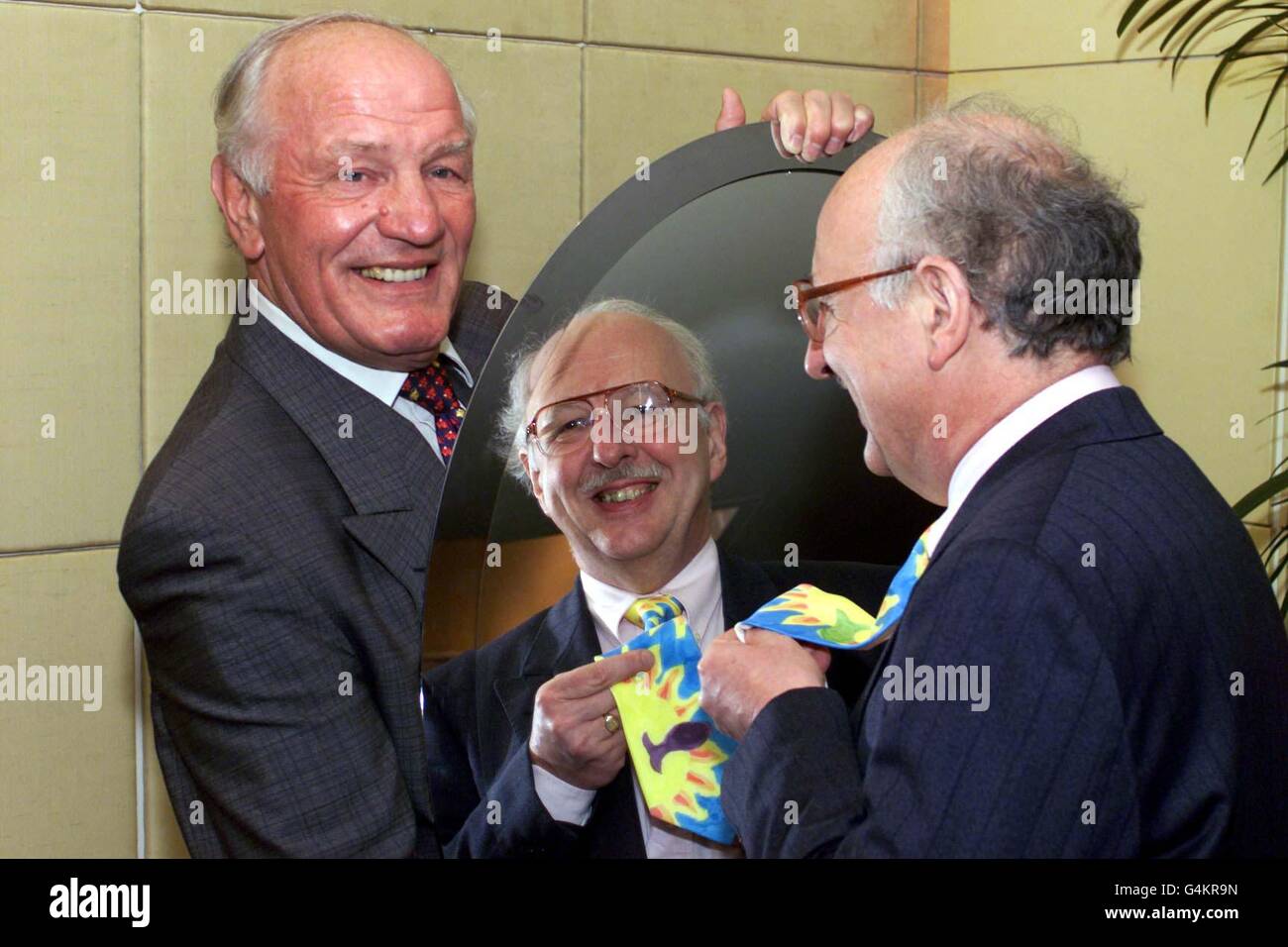 TV weatherman Michael Fish (right) and former boxer Henry Cooper were among those who collected awards as the country's best tie wearers. They received their Top of the Knots award - a gold tie pin - from the Guild of British Tie Makers at a London reception. Stock Photo