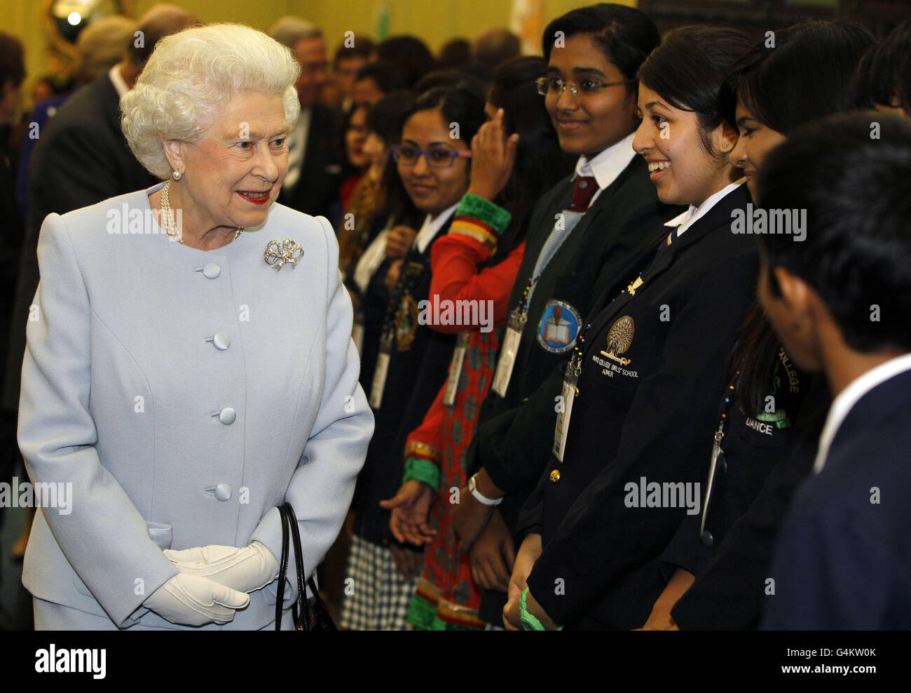 Queen Elizabeth II (left) meets students after she officially opened