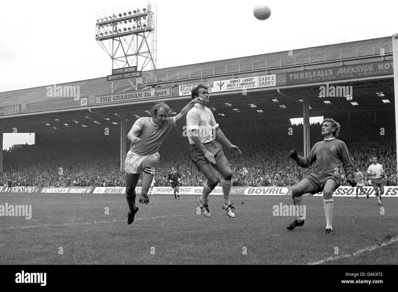 Soccer - League Division One - Manchester City v Leeds Unite - Maine Road. Leeds United defender Terry Cooper (c) clears the ball away from Manchester City's Francis Lee (l), watched by goalkeeper Gary Sprake. Stock Photo