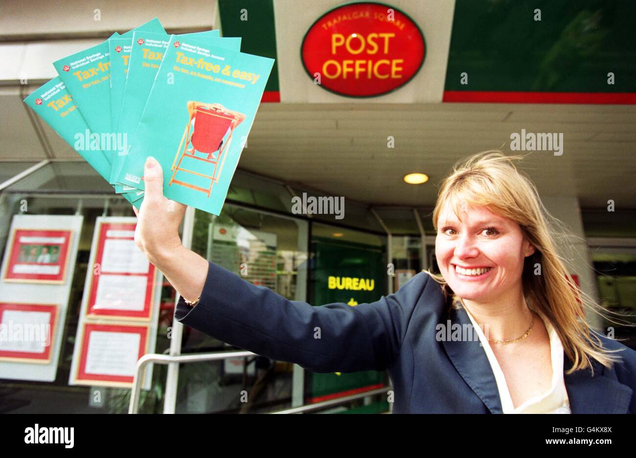 Gill Cattanach, Head of Commercial Development for National Savings, at the Trafalgar Square Post Office in London showing off the brochure for the new National Savings cash mini ISA. * National Savings announced that it is to offer its cash mini ISA over the counter at over 19,000 post offices nationwide. Stock Photo