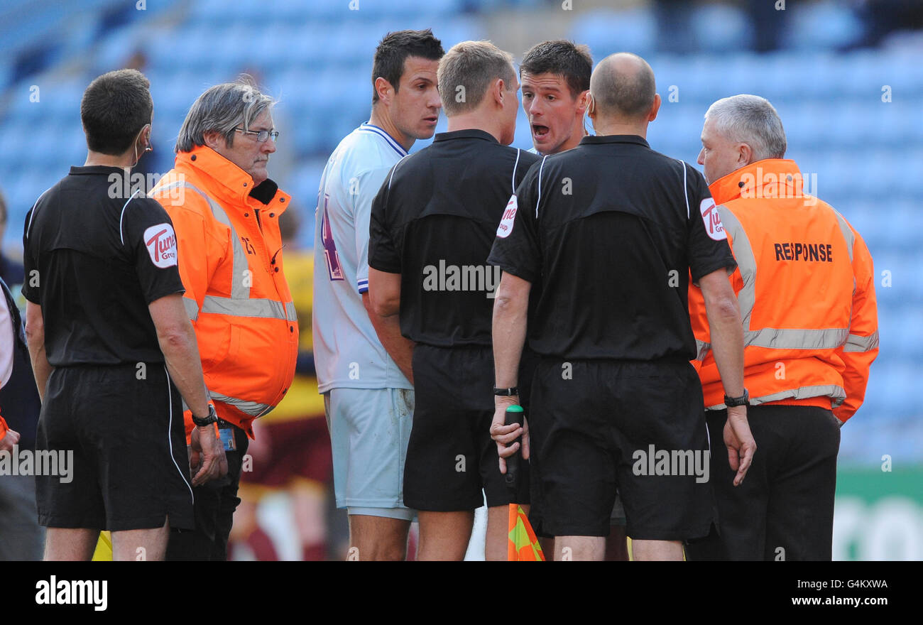 Coventry City's Lukas Jutkiewicz protests to referee Graham Scott after the final whistle during the npower Football League Championship match at the Ricoh Arena, Coventry. Stock Photo