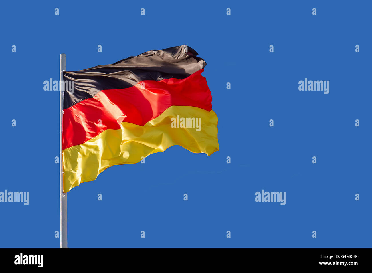 Germany flag is waving in front of blue sky Stock Photo