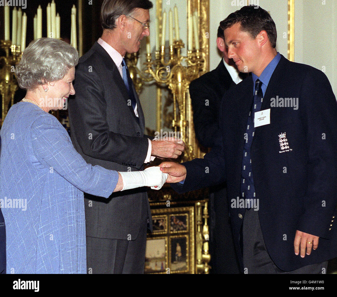 The Queen shakes hands with England cricketer Darren Gough during a reception at Buckingham Palace in London for the World Cup cricket teams. Stock Photo