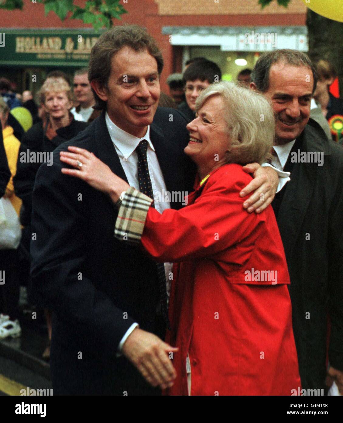 British Prime Minister Tony Blair and Glenys Kinnock, the MEP for South East Wales, embrace during Mr Blair's visit to Pontypridd in Wales. Stock Photo