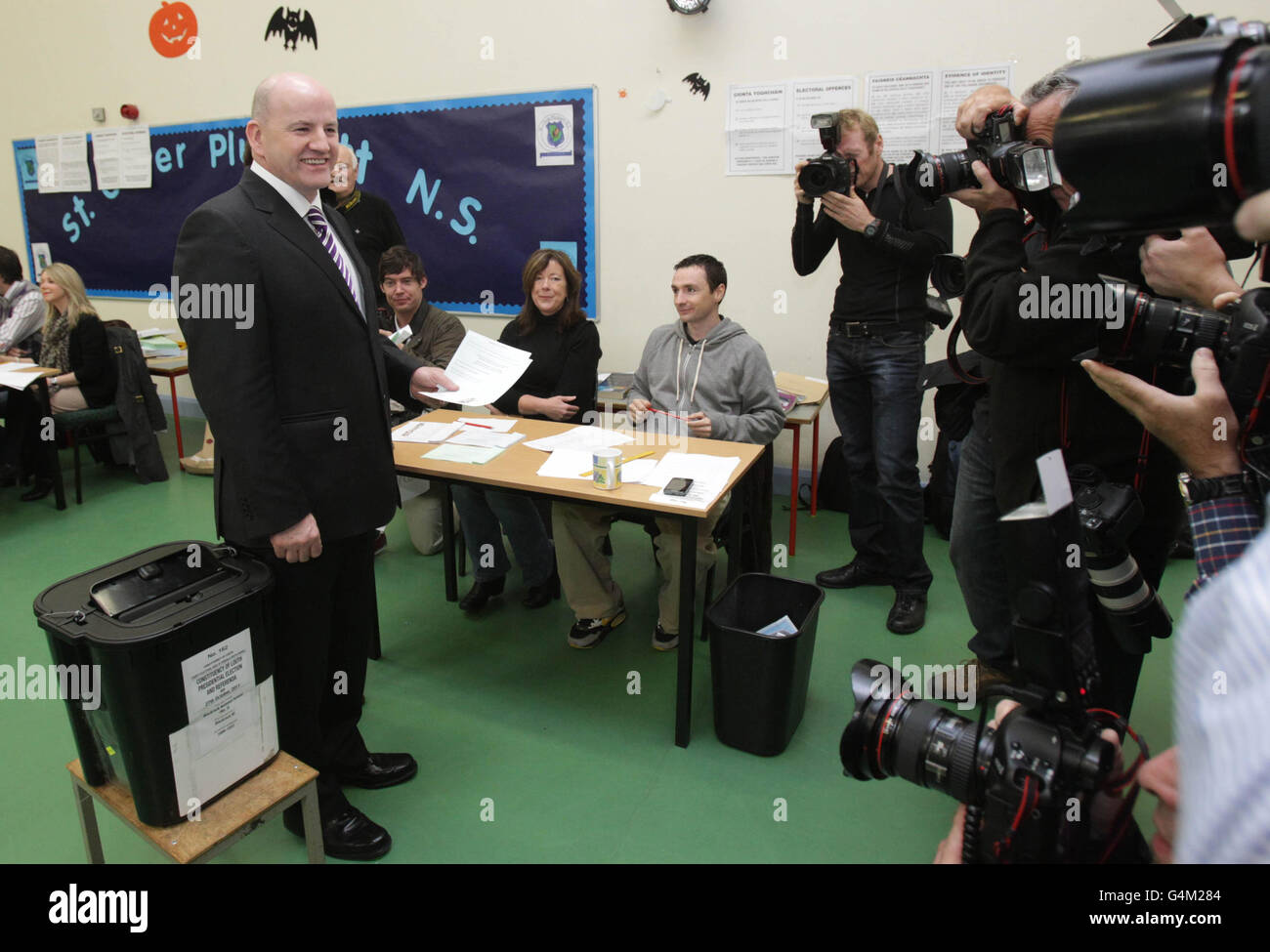 Irish presidential candidate Sean Gallagher, poses for the media as he casts his vote at Blackrock National School, Dundalk, Co Louth, as voters across Ireland go to the polls today to elect the country's ninth president. Stock Photo
