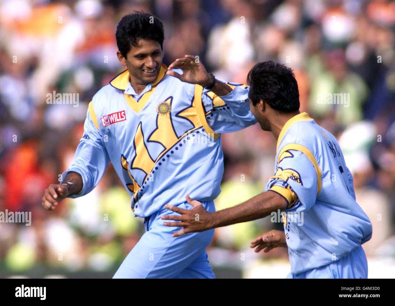 Venkatesh Prasad (left) is congratulated by team-mate Robin Singh after taking the vital wicket of Pakistani Moin Khan during their World Cup cricket Super Six match at Old Trafford in Manchester. Venkatesh Prasad was the Man of the Match, with five wickets. Stock Photo
