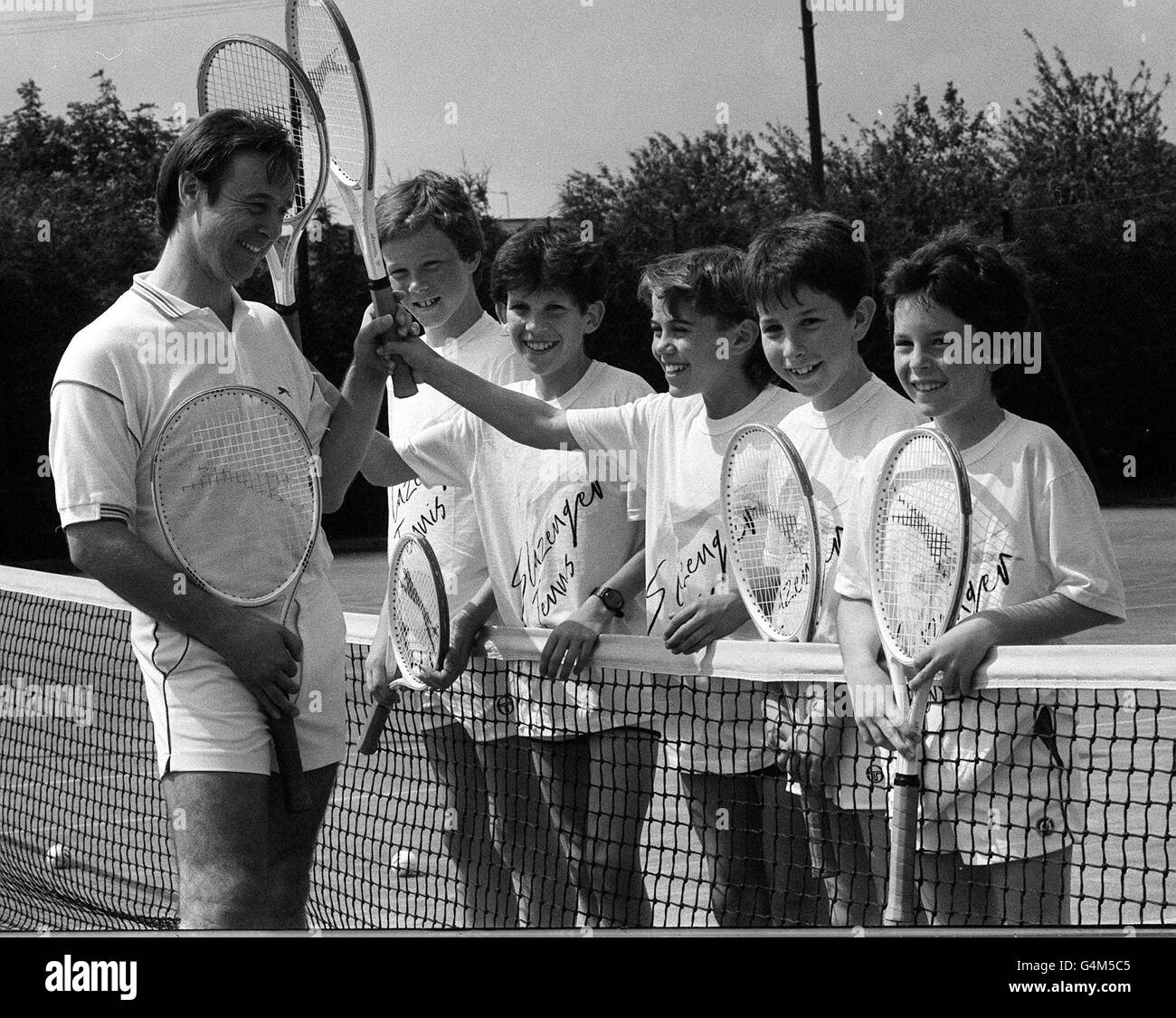 Tim Henman aged 13 (2nd boy from left), with head coach David Lloyd at the Slasenger Raquet Club. The Club had a scholarship scheme for promising young players, and was the brainchild of financier Jim Slater. * Boys (from left): James Bailey, Tim Henman, David Loosemore, Paul Jessop, James Delgado. Stock Photo
