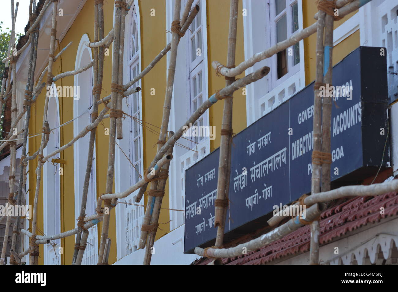 Mumbai, India - October 22, 2015 - Indian workers on bamboo scaffold Stock Photo