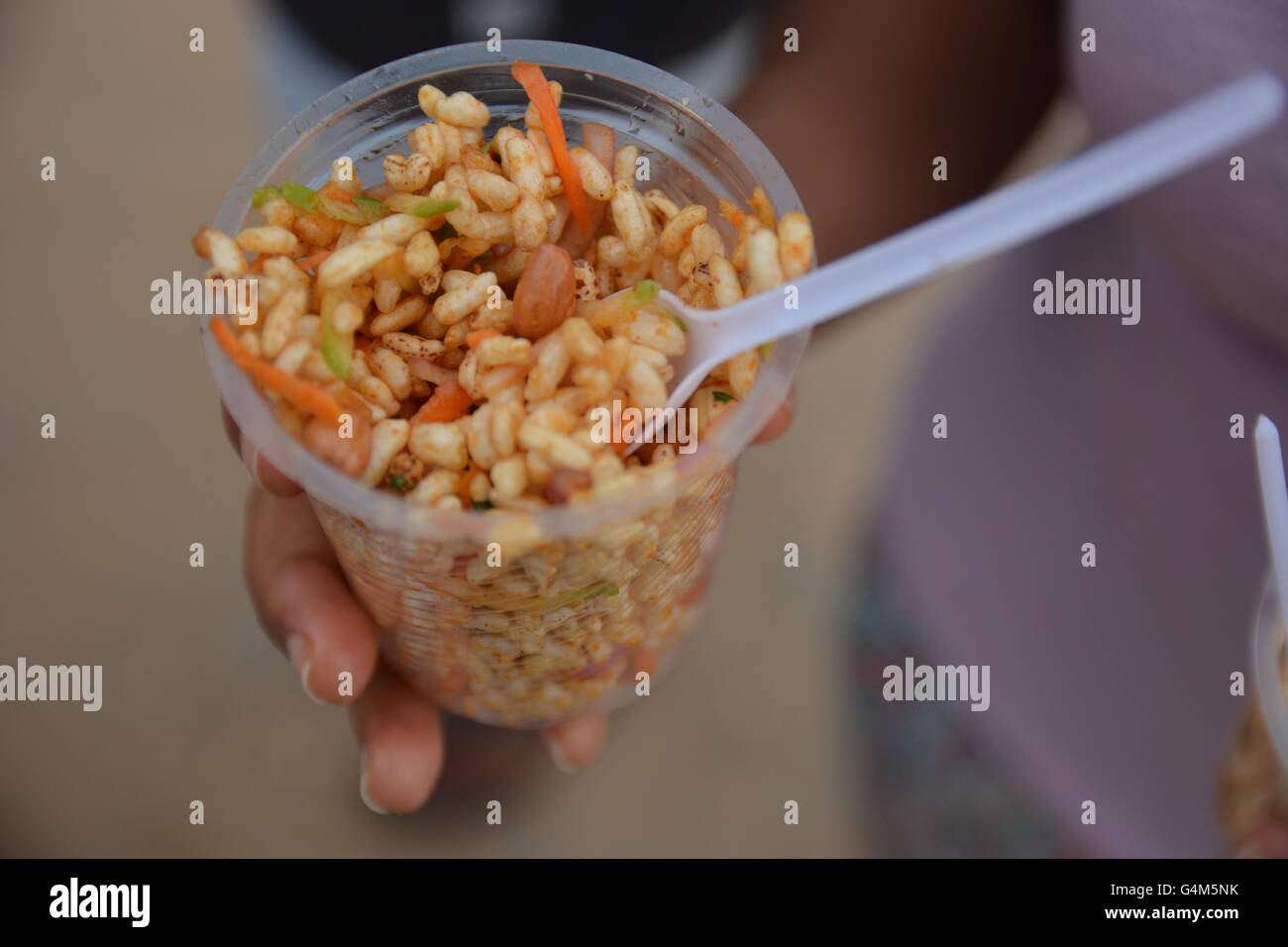 Mumbai, India - October 26, 2015 - Indian food charmuri prepared by woman in Mumbai Stock Photo