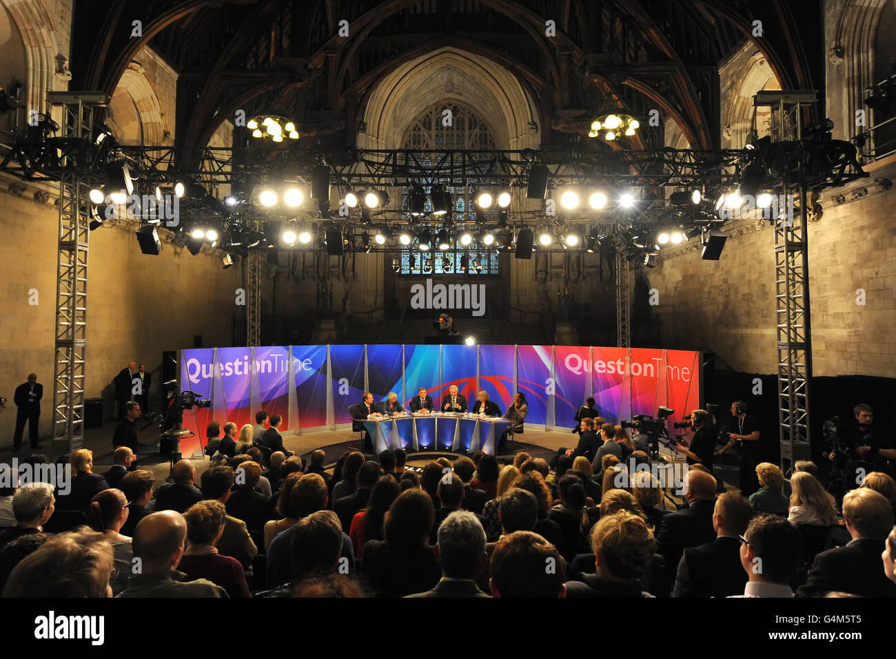 Host David Dimbleby (fourth from left) and panellists (left to right) Peter Hitchens, Baroness Shirley Williams, Shadow Chancellor Ed Balls, Home Secretary Theresa May and poet Benjamin Zephaniah prepare for a recording of the BBC's 'Question Time', in Westminster Hall, London. Stock Photo