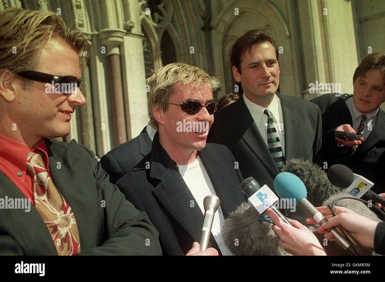 Former members of 80's pop group Spandau Ballet, Saxophonist Steve Norman (left) drummer John Keeble and lead singer Tony Hadley (right), outside London's High Court, where they lost their claim for royalties from songwriter Gary Kemp. Stock Photo