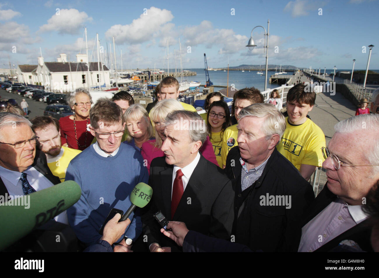 Presidential candidate Gay Mitchell (centre) canvases with Fine Gael colleagues on the East Peir in Dun Laoghaire. Stock Photo