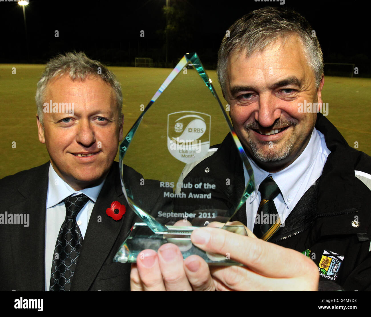 Ed Crozier (Glasgow North Scottish Rugby Council representative) (left) hands the trophy to Helensburgh Rugby Club President Jon Simmons after the club won RBS club of the month for September during a photocall at Helensbrugh Rugby Club, Helensbrugh. Stock Photo