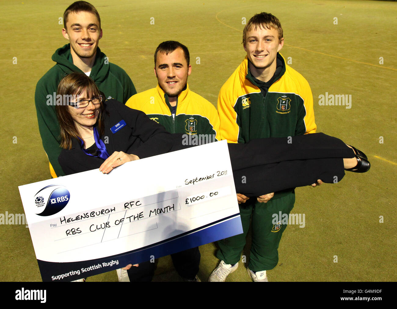 Helensburgh Rugby Club players Aaron Sterry (left), Terry Smith (centre) and David Sterry with local Royal Bank of Scotland rugby representative Catriona McArthur after the club won RBS club of the month for September during a photocall at Helensbrugh Rugby Club, Helensbrugh. Stock Photo