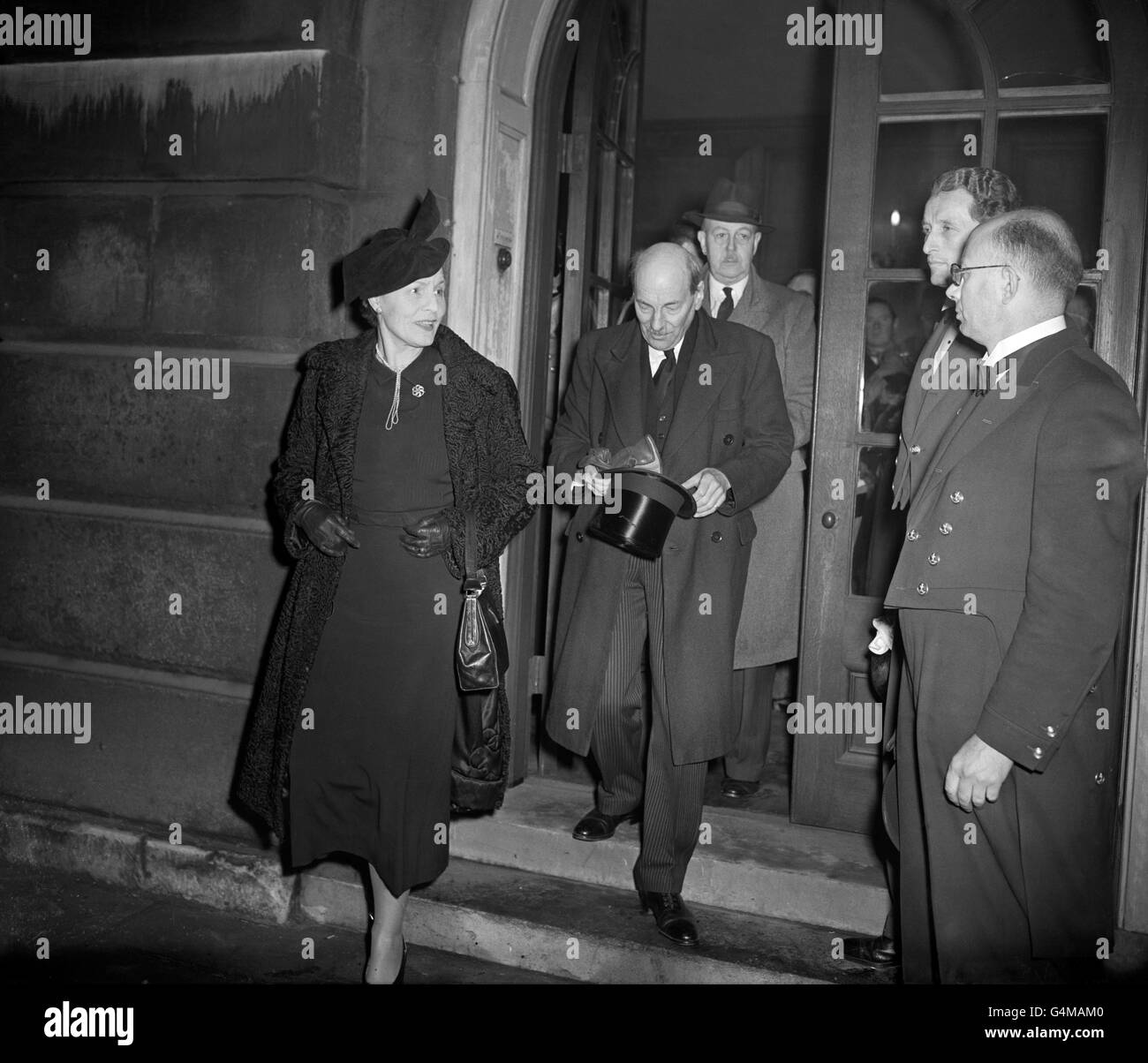 Leader of the Opposition Clement Attlee and Dr Edith Summerskill leaving St. James's Palace, after attending the Privy Council meeting following the death of King George VI. The Council is automatically summoned on the death of the monarch and is traditionally known as the Accession Council. Stock Photo
