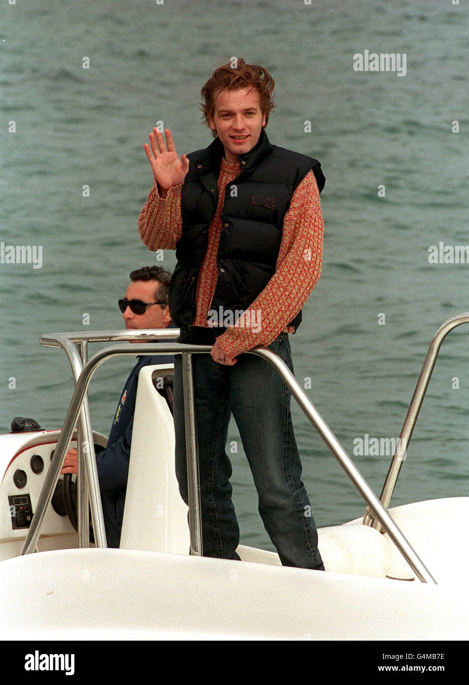 Ewan Mcgregor arrives at the Majestic Beach Pier on a speedboat for a photocall for his new movie 'Nora' in which he takes a co-producer role produced through his production company Natural Nylon during the Cannes Film Festival 1999 in France. Stock Photo