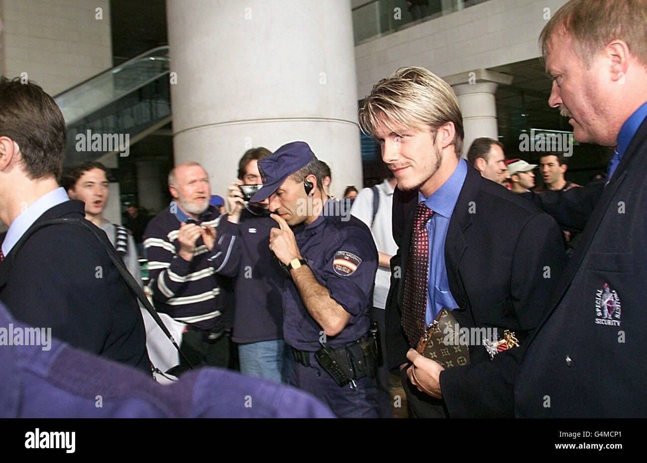 Manchester United midfielder David Beckham makes his way past fans after his side arrived on Concorde at Barcelona prior to the European Cup Final against Bayern Munich. Stock Photo