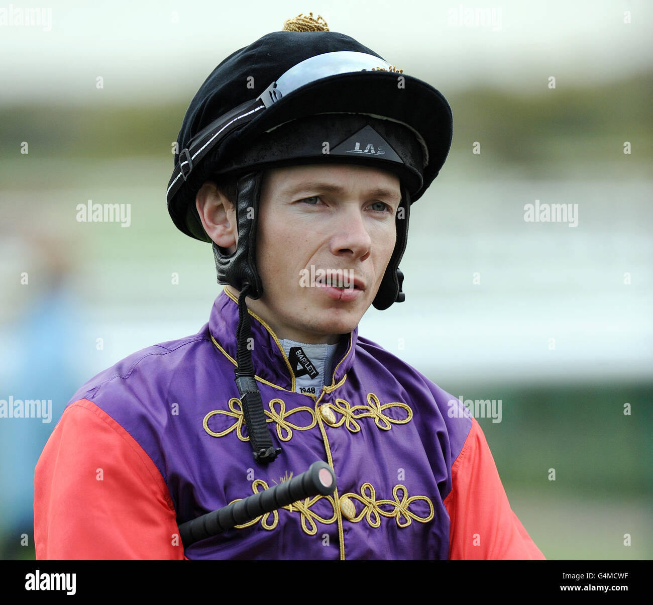 Jockey jamie spencer wears the queens colours at doncaster racecourse ...
