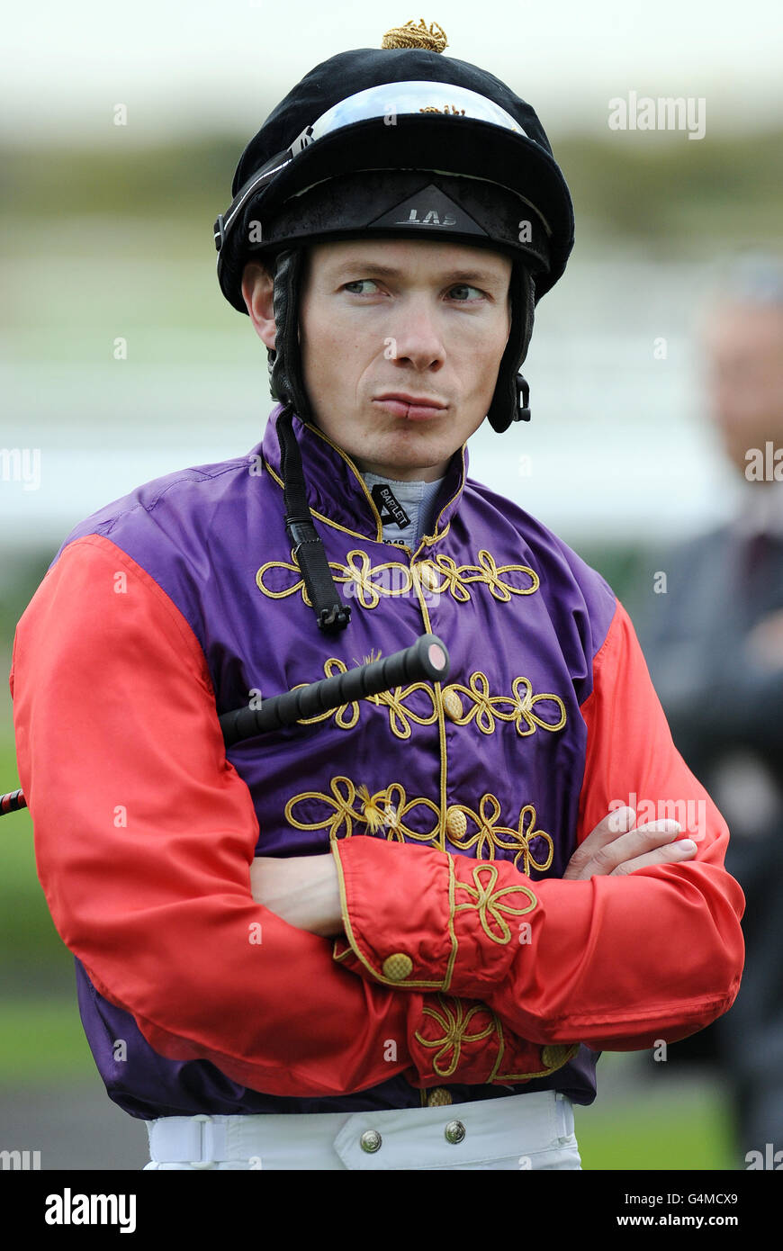 Jockey jamie spencer wears the queens colours at doncaster racecourse