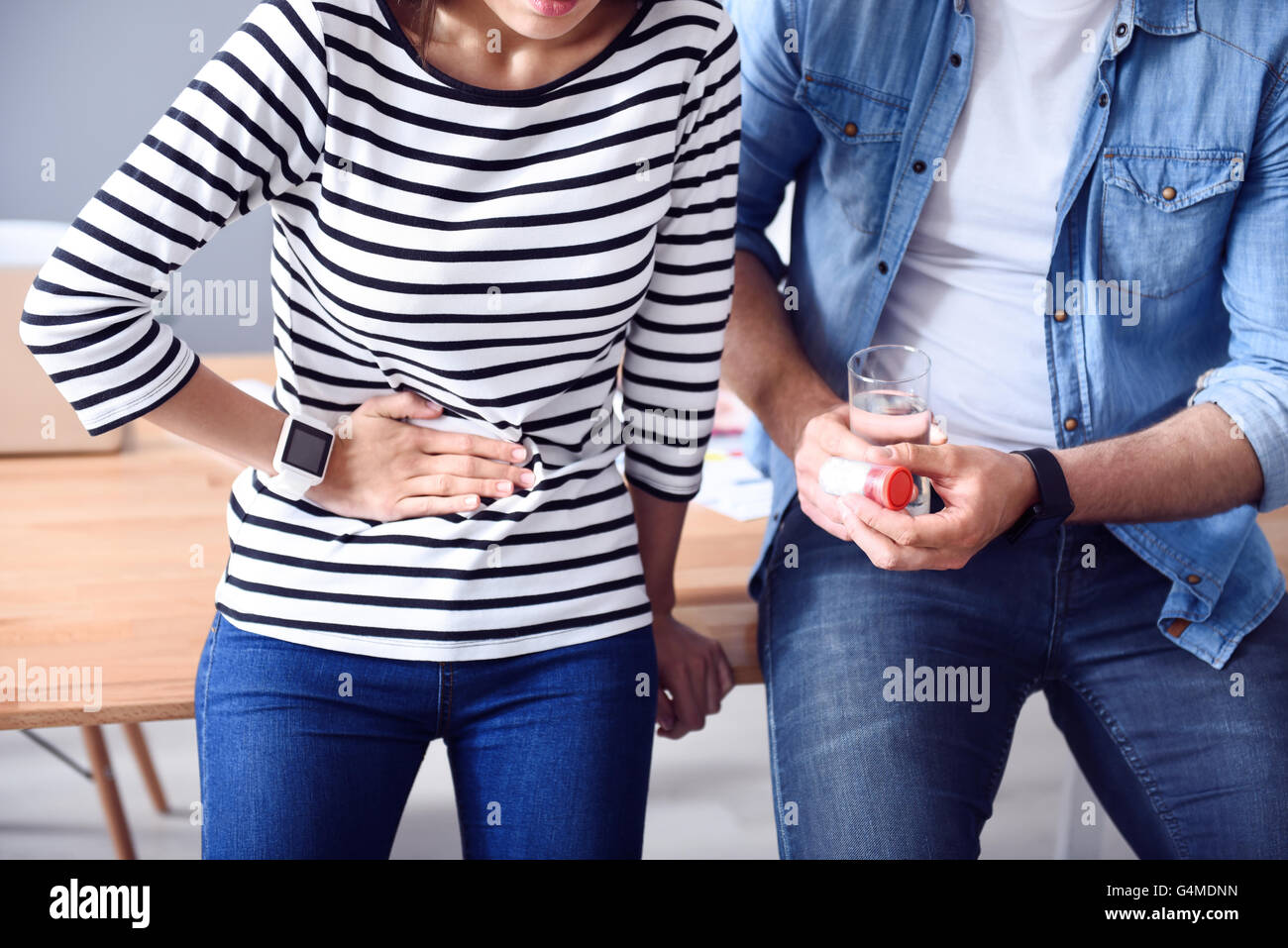 Sick woman feeling pain in stomach Stock Photo Alamy