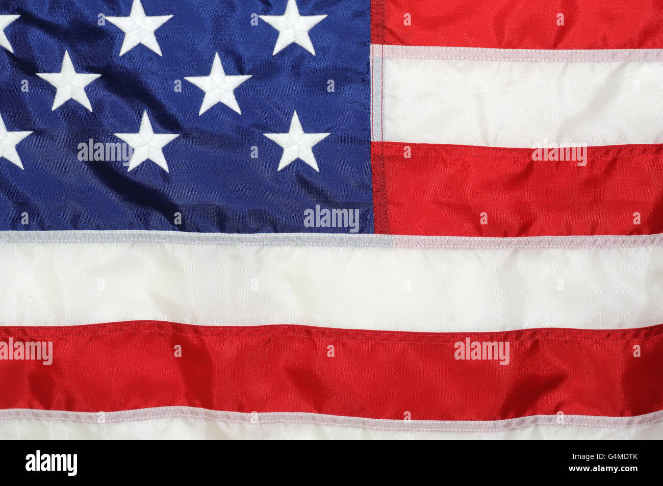 Closeup of U.S. Flag showing a few stars and some stripes. Stock Photo