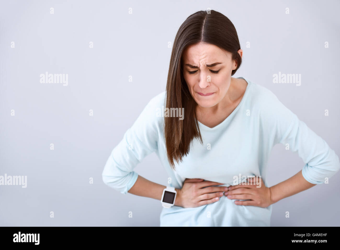 Sick woman having a stomach ache Stock Photo Alamy